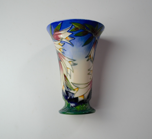 Discover the elegance of the Moorcroft Ivory Bell Vase 2004. Standing at 16cm high, it adds beauty to any space. Shop now to enhance your decor!