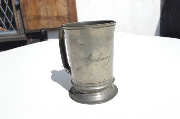 Discover our Victorian pewter tankard, a unique piece from Archway Tavern pub, made by Watts, Euston no. 256. Ideal for historical collectors, shop now!
