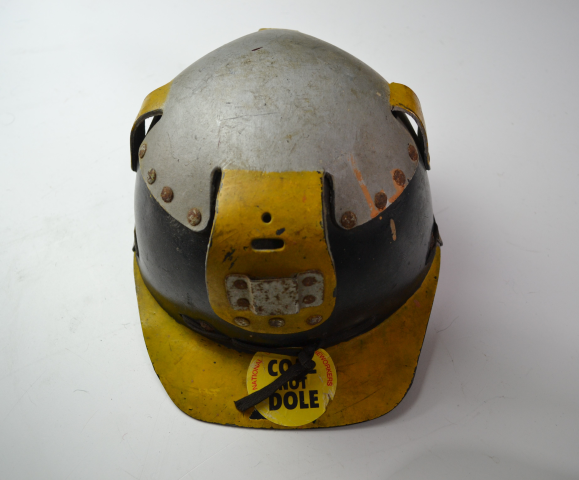 Discover our range of authentic 1980s coal miners' helmets. Own a piece of history with our Coal, not dole stickered helmets in good condition. Shop now!
