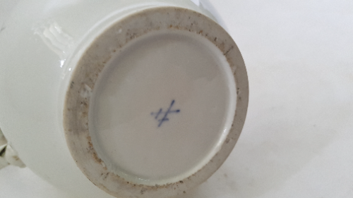 Discover the charm of 18th century Meissen porcelain coffee pot. Decorated with Deutsche Blumen on pure white ground, it's a perfect blend of art and history. Explore now!