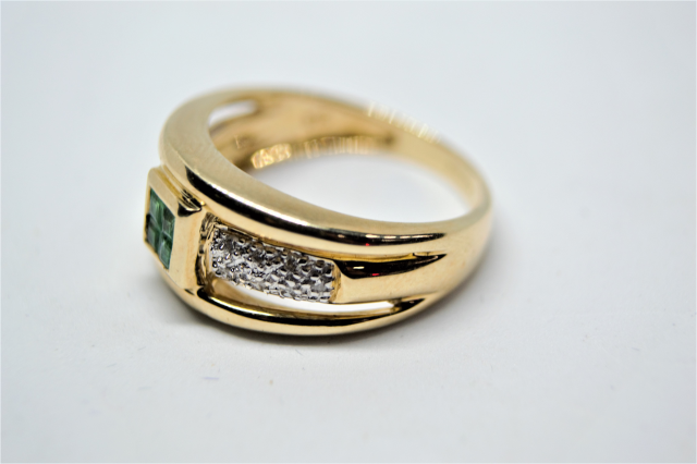 A 9ct Gold Emerald and Diamond Ring. 