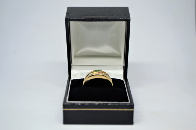A 9ct Gold Emerald and Diamond Ring. 