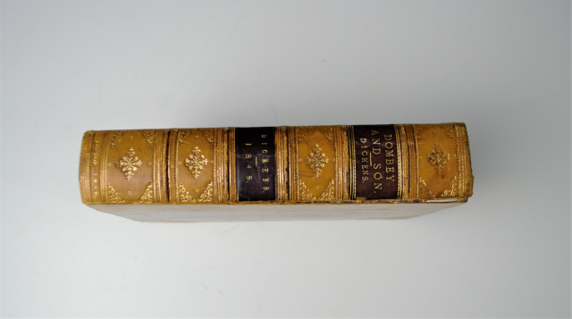 Discover our 1st Edition Charles Dickens' Dombey & Son dated 1848. Despite minor fades, it's a well-preserved, valuable 150-year-old piece. Shop now!