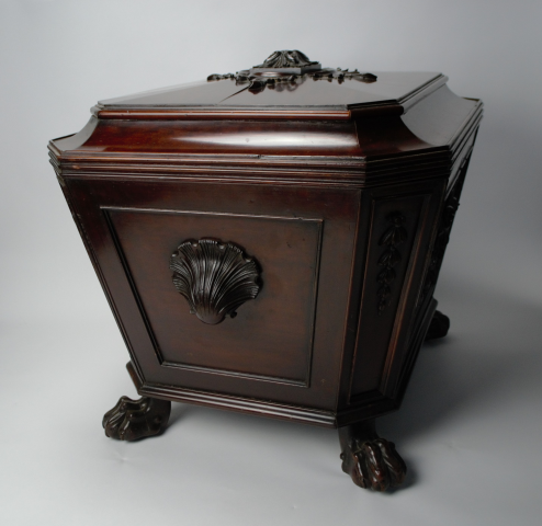 Experience elegance with our late Regency mahogany sarcophagus wine cooler. Stunningly carved with lion's paw feet and lead-lined interior. Shop now. Size: 70x56x60cm.