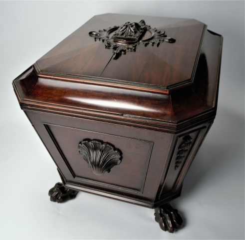 Experience elegance with our late Regency mahogany sarcophagus wine cooler. Stunningly carved with lion's paw feet and lead-lined interior. Shop now. Size: 70x56x60cm.