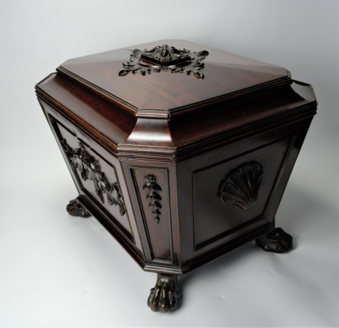 Experience elegance with our late Regency mahogany sarcophagus wine cooler. Stunningly carved with lion's paw feet and lead-lined interior. Shop now. Size: 70x56x60cm.