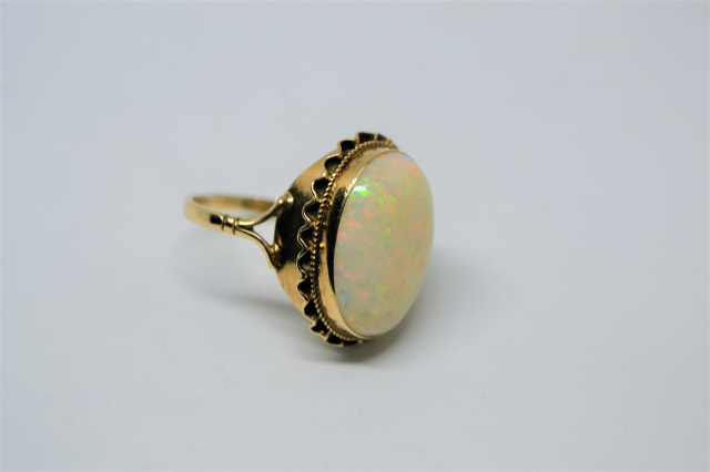 A 9ct Gold with Large Cabochon Cut Opal Ring.
