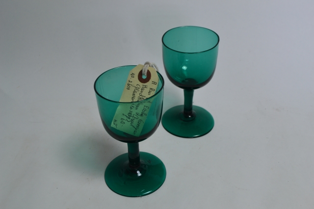 Discover our elegant pair of Georgian green wine glasses, a perfect addition to your table. Shop now for these unique, hand-crafted pieces with intricate detailing.
