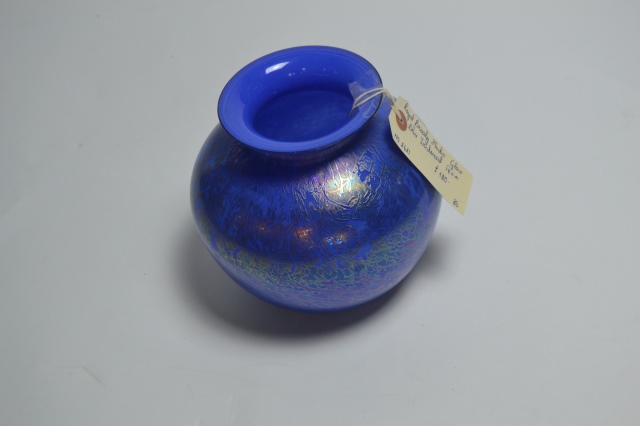 Explore our stunning range of Royal Brierley studio glass, featuring captivating blue, iridescent designs. Standing at 18cm high, it's the perfect addition to any decor. Shop now!