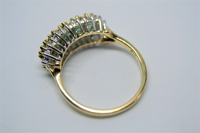 Discover our 9ct gold ring, studded with emeralds and diamonds. Expertly crafted in Sheffield. Weighs 2.9g, size N. Shop now to add a touch of luxury to your collection.