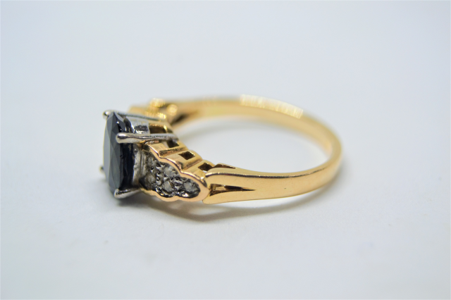 A 14k Gold Sapphire and Diamond Ring. 