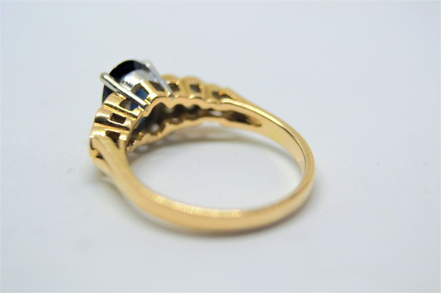 A 14k Gold Sapphire and Diamond Ring. 