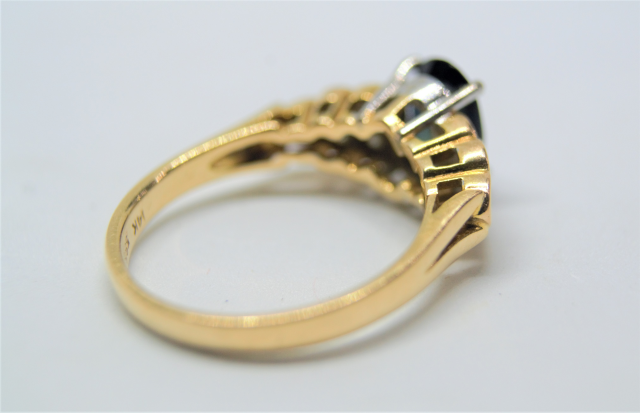 A 14k Gold Sapphire and Diamond Ring. 