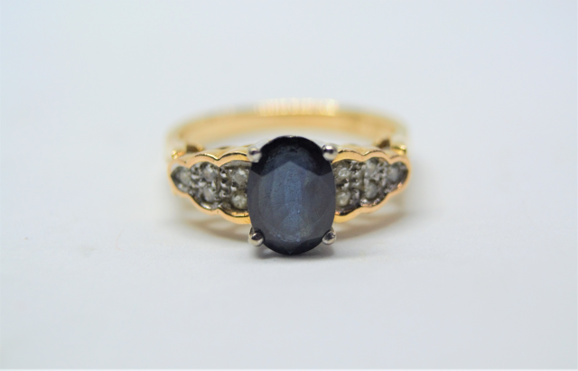 A 14k Gold Sapphire and Diamond Ring. 
