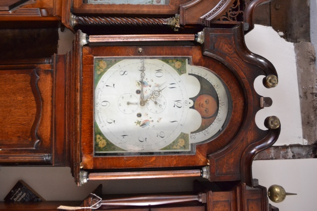 Discover our Grocot's Eight-Day Long Cased Oak Clock featuring a second hand, date hand, and moon face. Shop now for timeless elegance and precision!