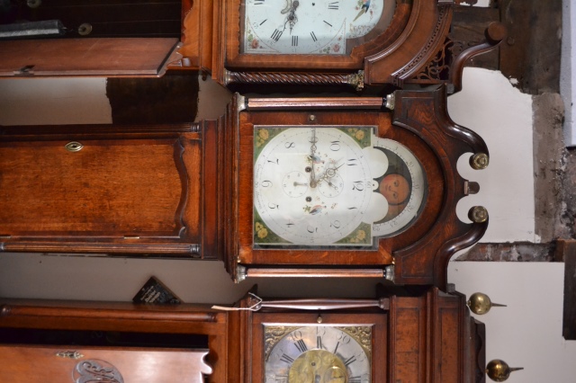 Discover our Grocot's Eight-Day Long Cased Oak Clock featuring a second hand, date hand, and moon face. Shop now for timeless elegance and precision!