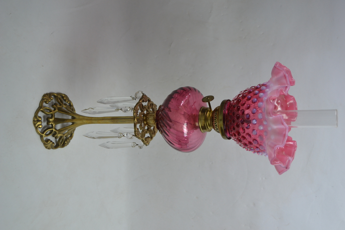 Discover our Art Nouveau style French Daudard brass oil lamp. Featuring a cranberry glass reservoir and dimpled shade. 50cm high. In premium condition. Shop now!