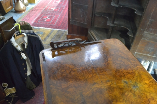 Discover our collection of Victorian burr walnut Canterbury whatnots. Fretwork gallery, moulded supports, single drawer & more. Browse now and enhance your home decor!