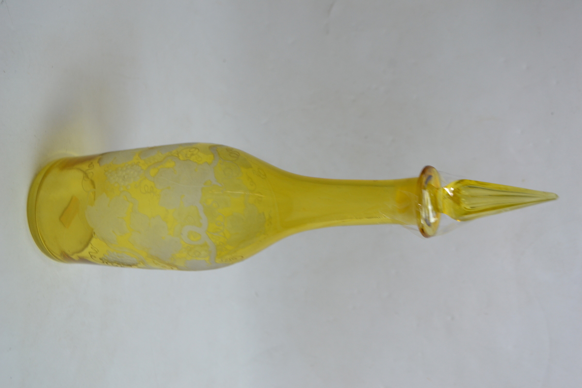 Discover an exquisite 19th-century continental bottle form decanter. Encased in citron over clear & flash engraved with a fruiting wine design. Order now!