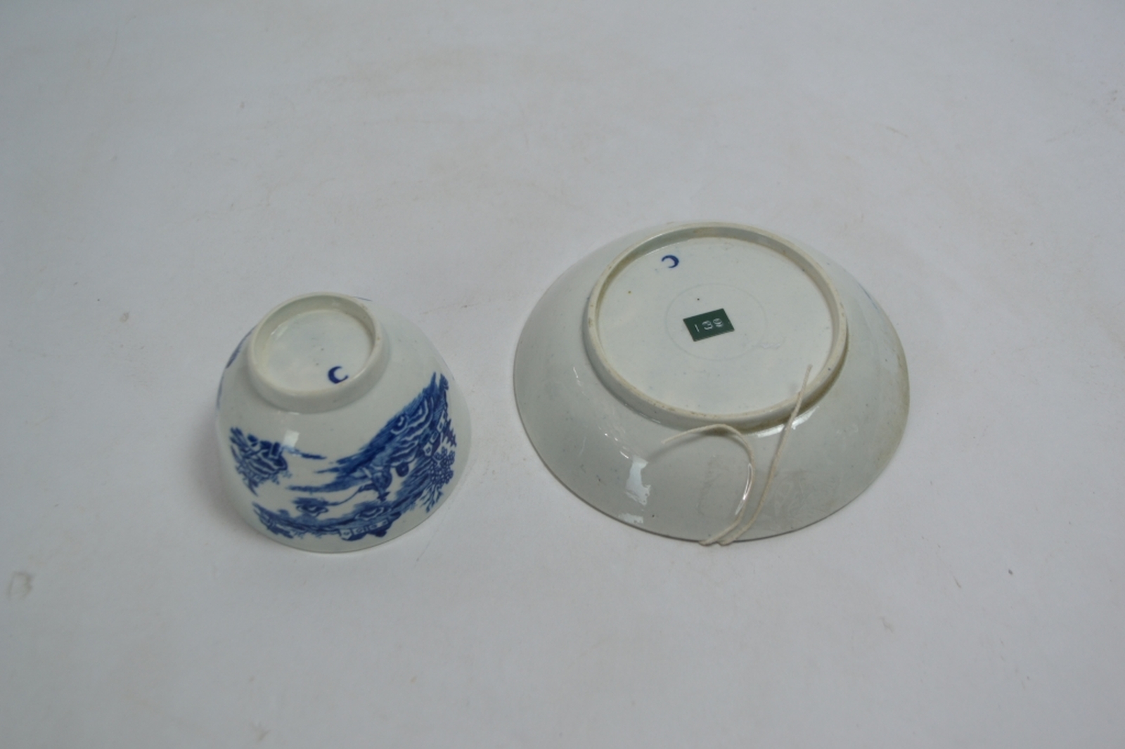 A Late 18th Century Worcester Teabowl and Saucer Decorated in the Underglaze Blue and White Fisherman and Cormorant Pattern