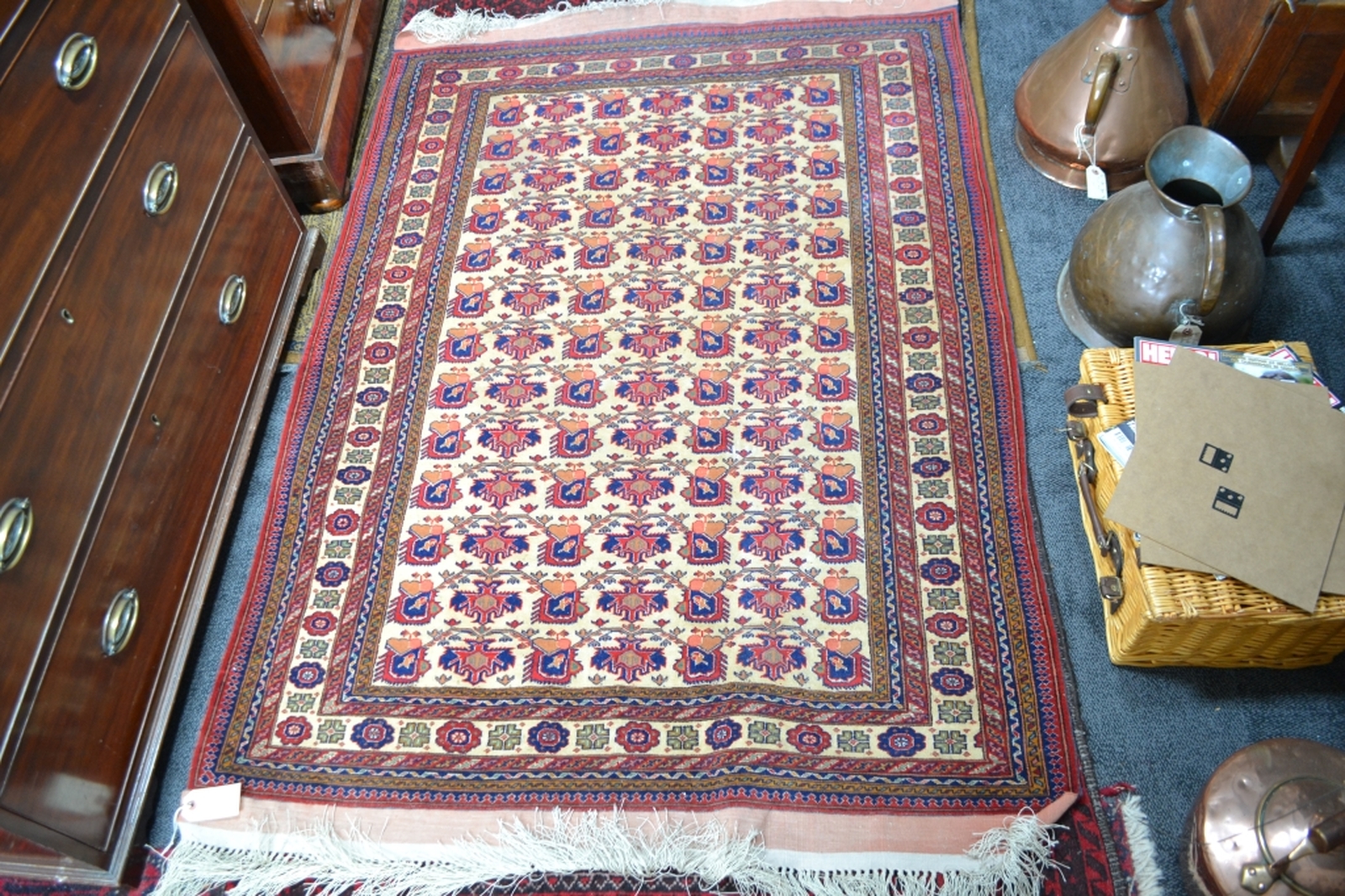 Discover our wide range of Turkish fringed carpets in cream ground with intricate designs in red and blue. Order now to enhance your home's aesthetic appeal!