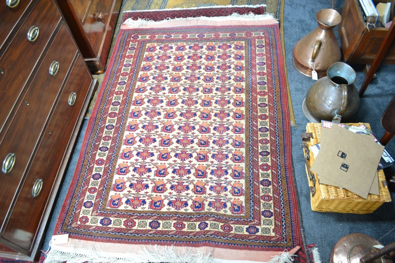 Discover our wide range of Turkish fringed carpets in cream ground with intricate designs in red and blue. Order now to enhance your home's aesthetic appeal!