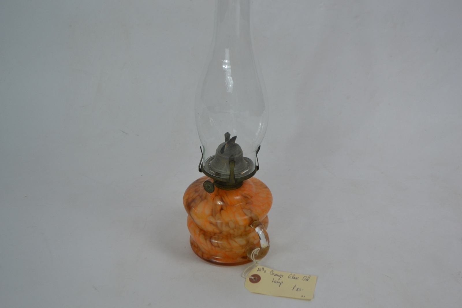 Early 20th century glass oil lamp with mottled orange reservoir