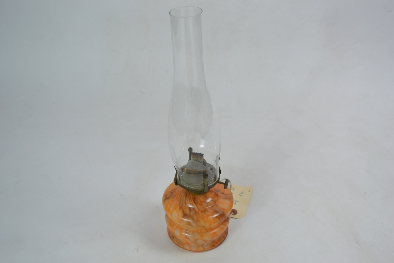 Early 20th century glass oil lamp with mottled orange reservoir