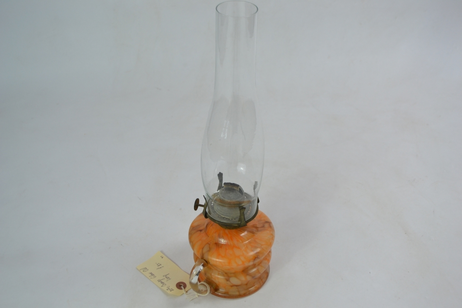 Early 20th century glass oil lamp with mottled orange reservoir