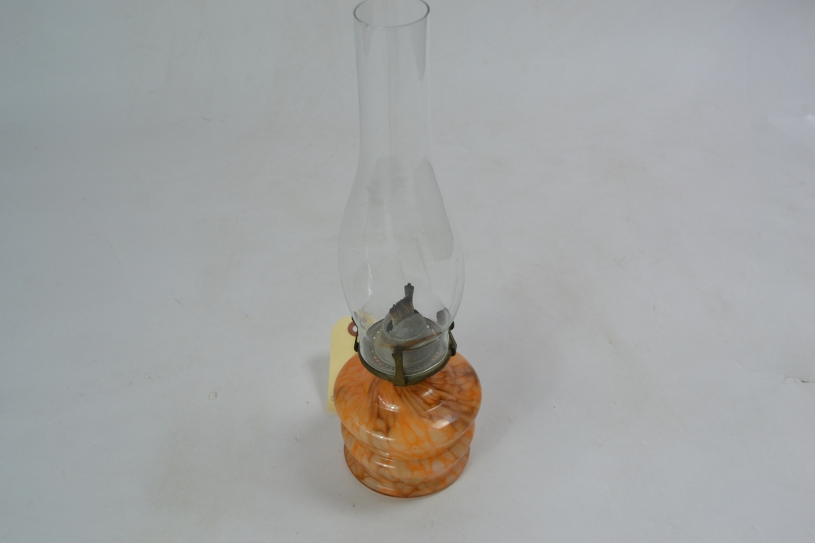 Early 20th century glass oil lamp with mottled orange reservoir