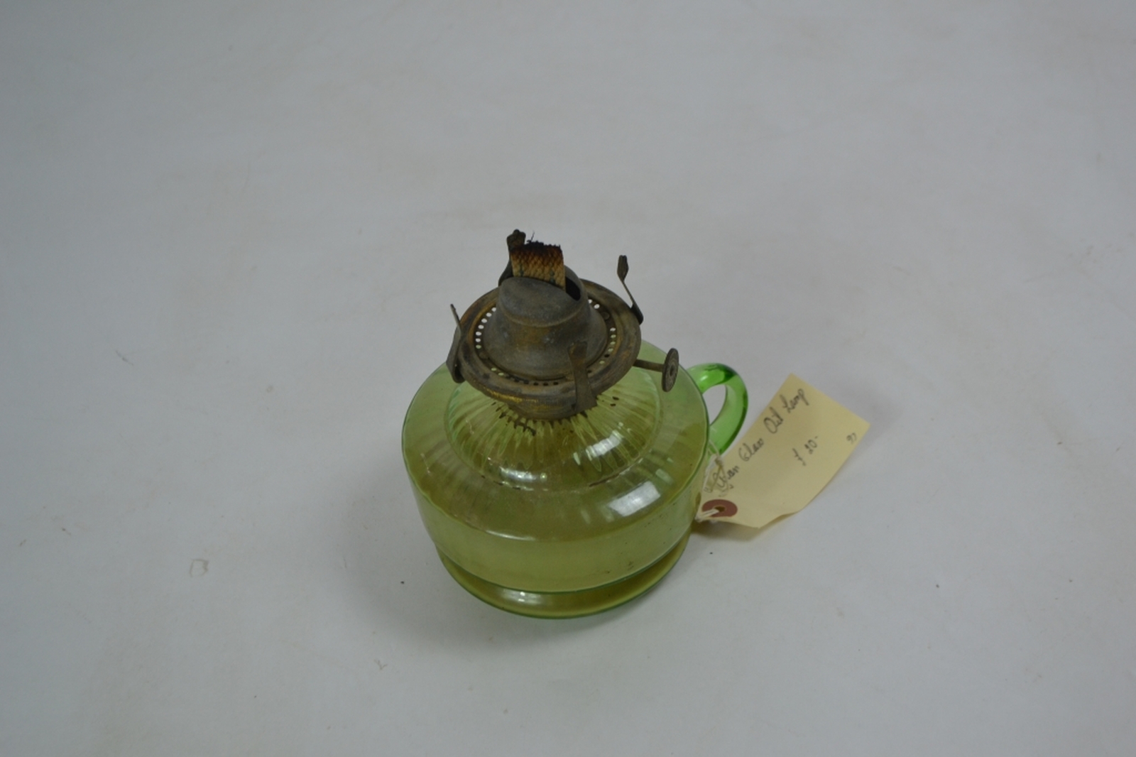 Early 20th century oil lamp with Incandescent green reservoir
