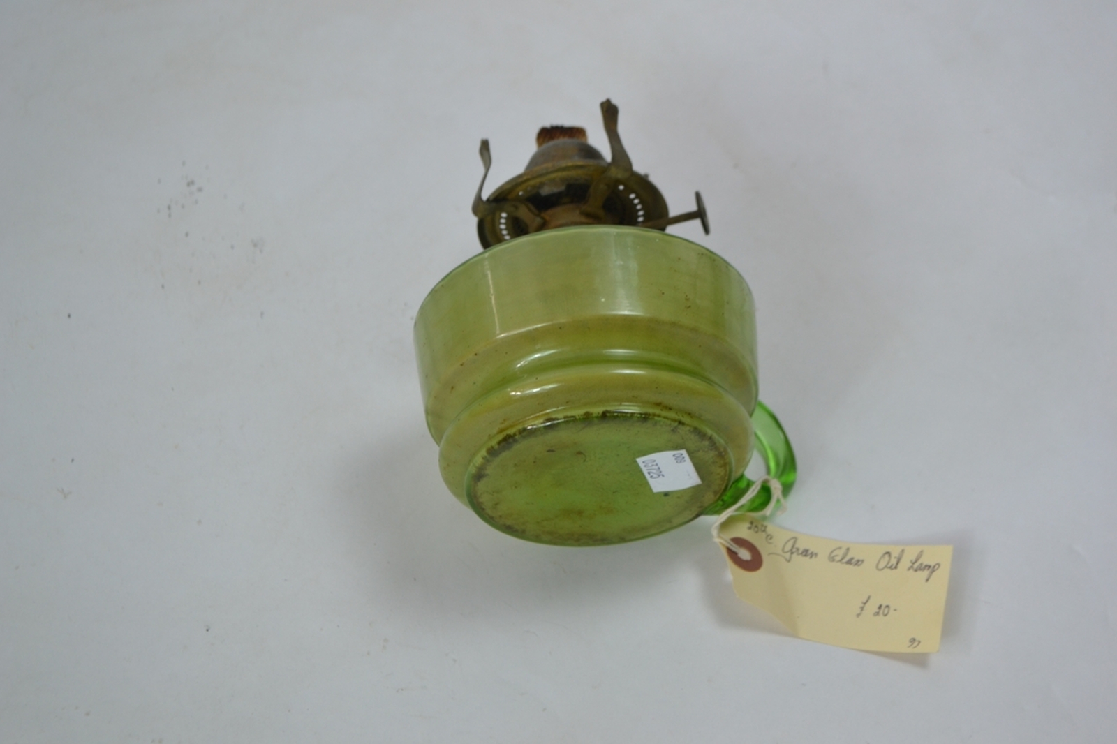 Early 20th century oil lamp with Incandescent green reservoir