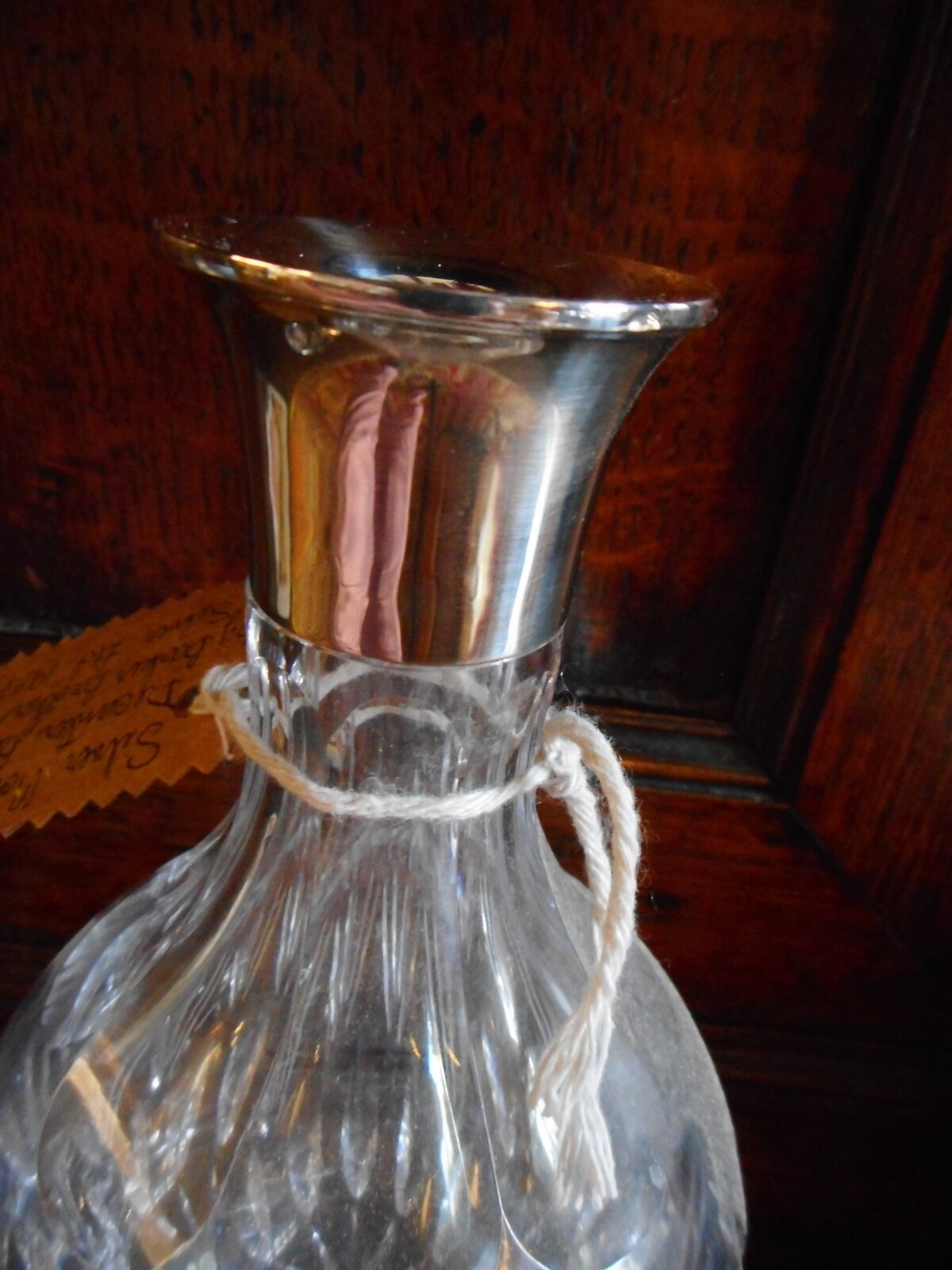 Discover a stunning 20th-century silver collared decanter from Barker Brothers. Hallmarked in 1957 and standing 27cms high. Explore now!