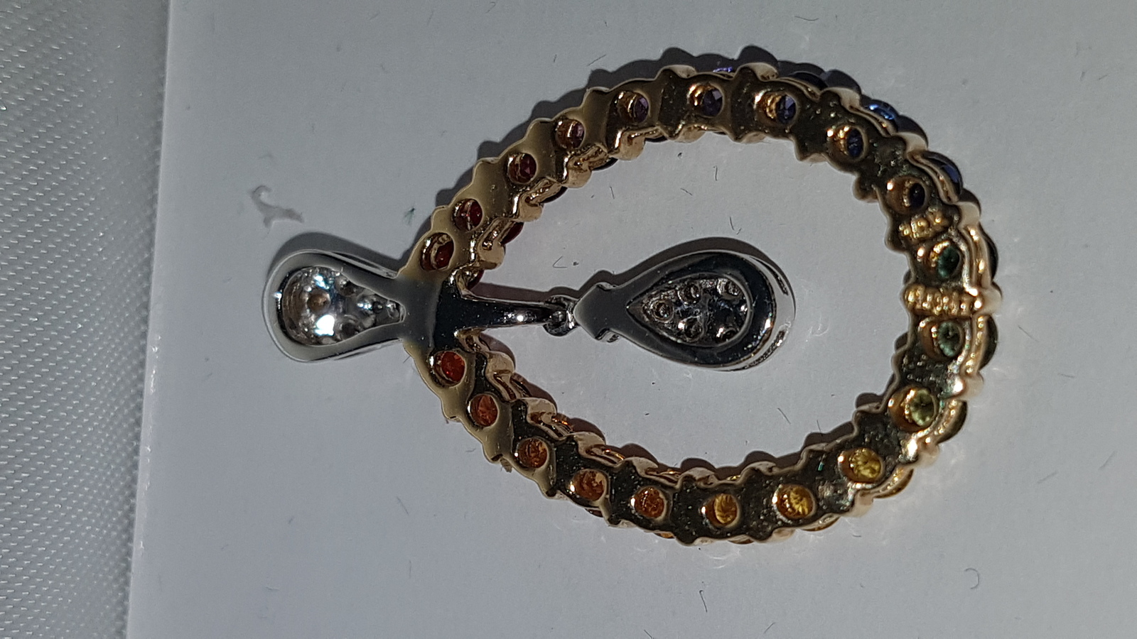 Discover our radiant multi-coloured sapphire and diamond pendant. Set in 14k gold, it weighs 3.8g and spans approx 3cm. Shop now and add sparkle to your life!