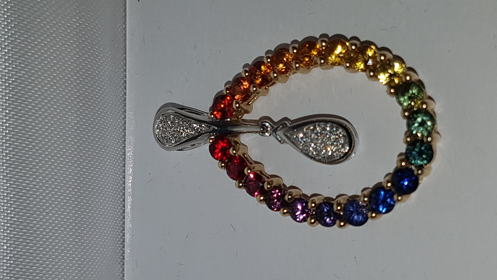 Discover our radiant multi-coloured sapphire and diamond pendant. Set in 14k gold, it weighs 3.8g and spans approx 3cm. Shop now and add sparkle to your life!