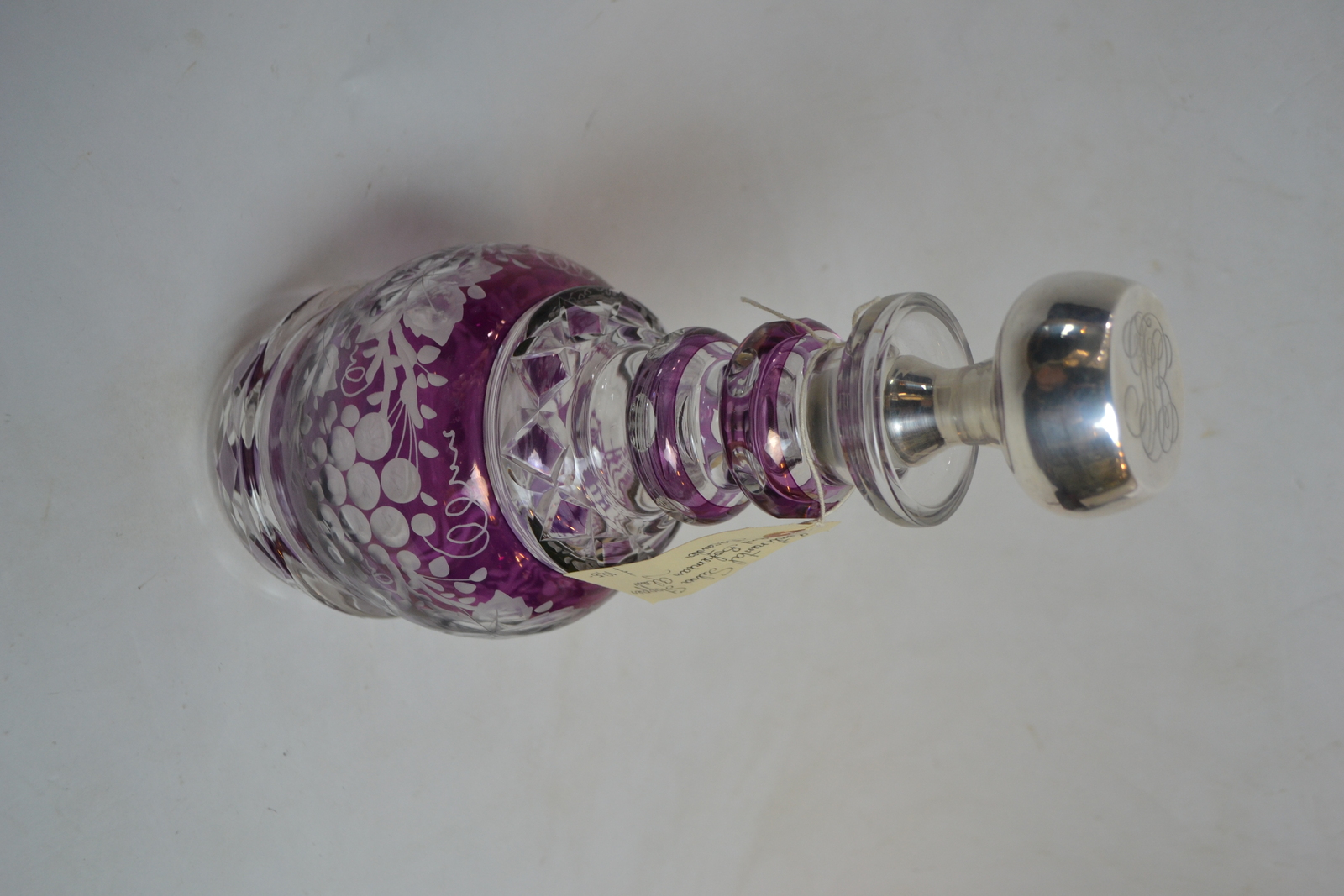 Discover our exquisite Continental silver and Bohemian glass decanter. 34cms high with a stunning purple glass overlay. Shop now for this unique find!
