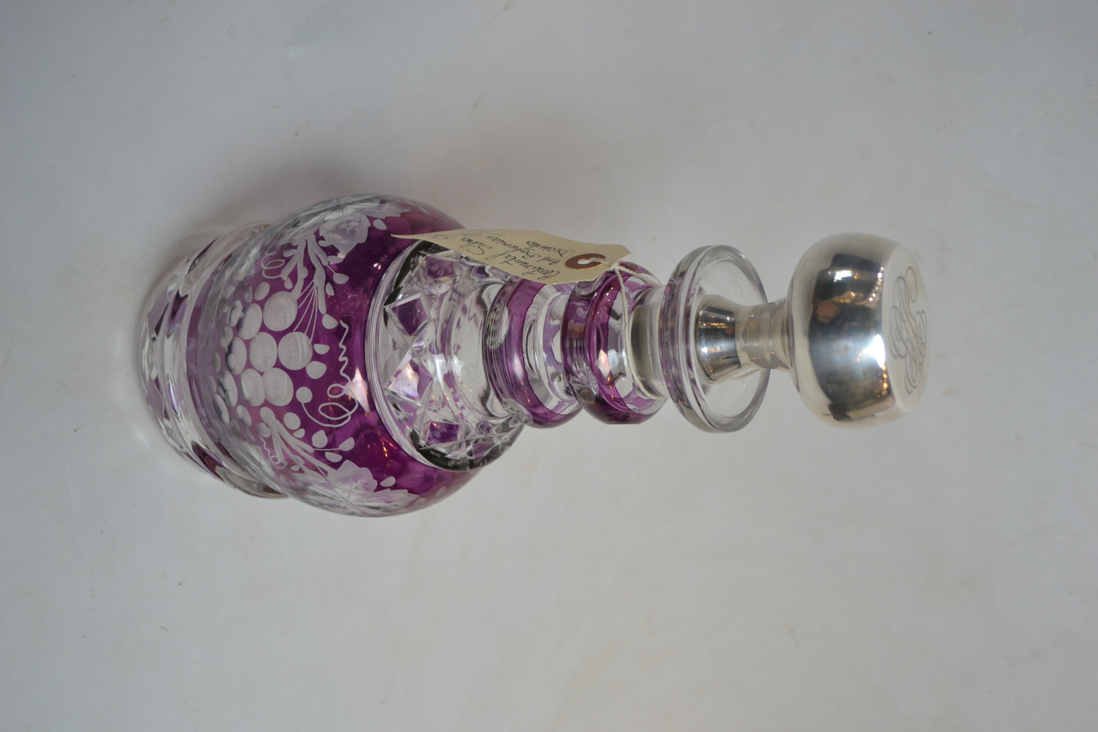 Discover our exquisite Continental silver and Bohemian glass decanter. 34cms high with a stunning purple glass overlay. Shop now for this unique find!
