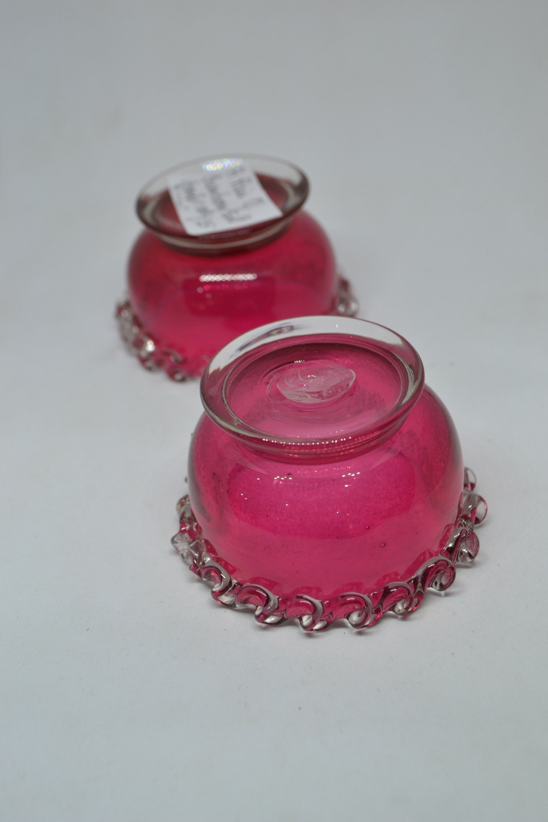 Discover our unique collection of 19th century cranberry salts. Each piece boasts intricate designs and rich color. Shop now for vintage tableware!