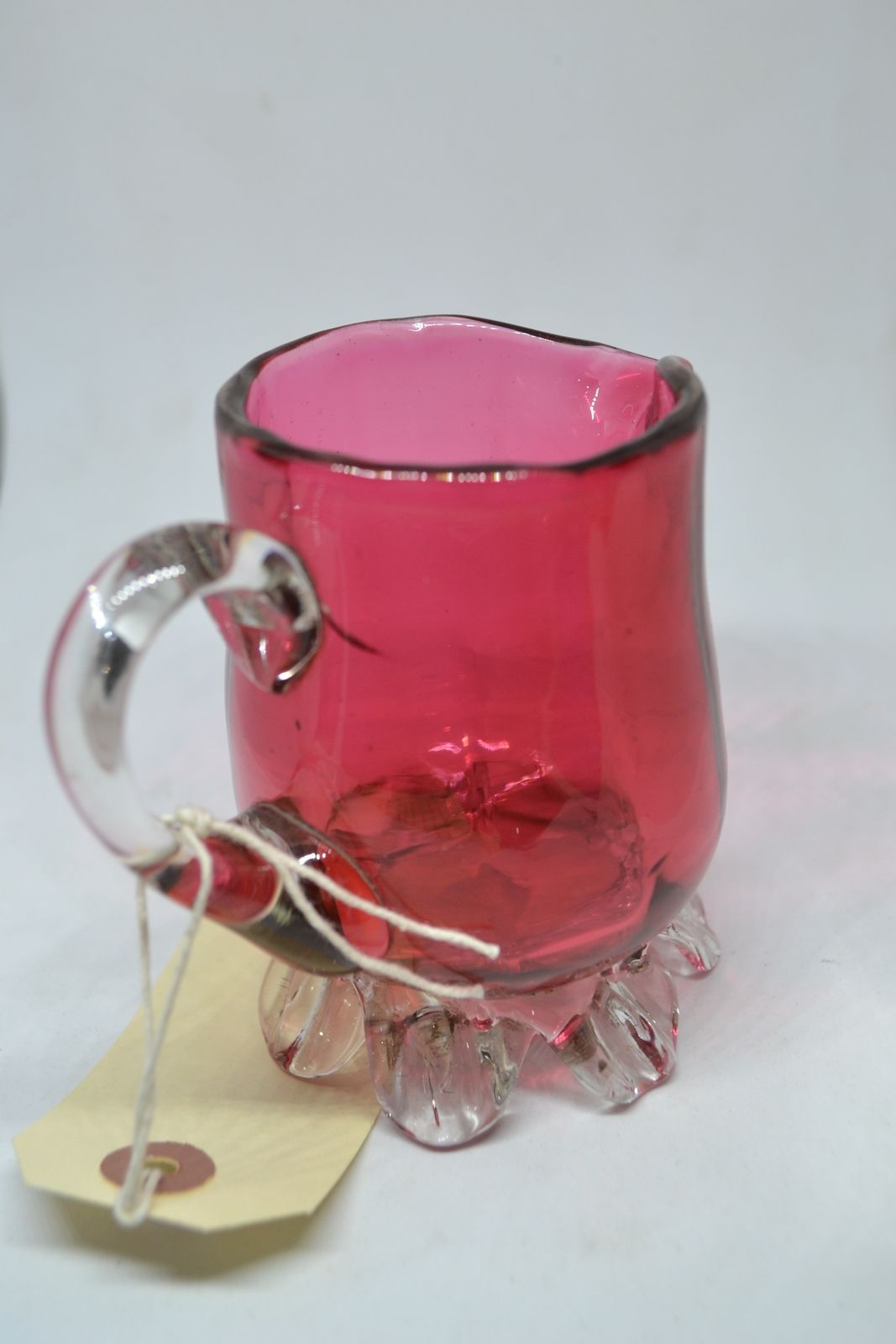 Discover our unique 1860 cranberry milk jug! Add a touch of vintage charm to your decor with this one-of-a-kind antique. Shop now and delve into history!