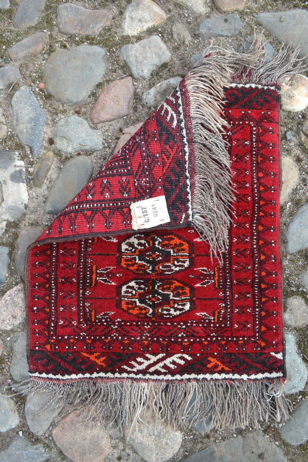 Discover our unique Bokhara pattern prayer mats in a striking red ground. Sized perfectly at 60cm x 50cm, they're too good to miss! Shop now.