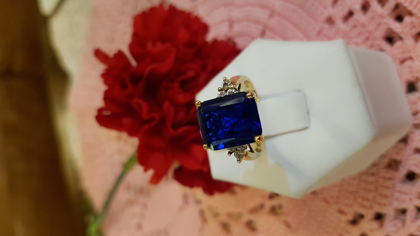 Explore our collection of 9ct yellow gold rings, featuring a stunning emerald cut Spinel adorned with Cubic Zirconia. Shop now for your perfect fit in size M.