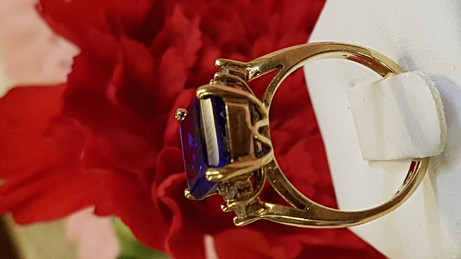Explore our collection of 9ct yellow gold rings, featuring a stunning emerald cut Spinel adorned with Cubic Zirconia. Shop now for your perfect fit in size M.