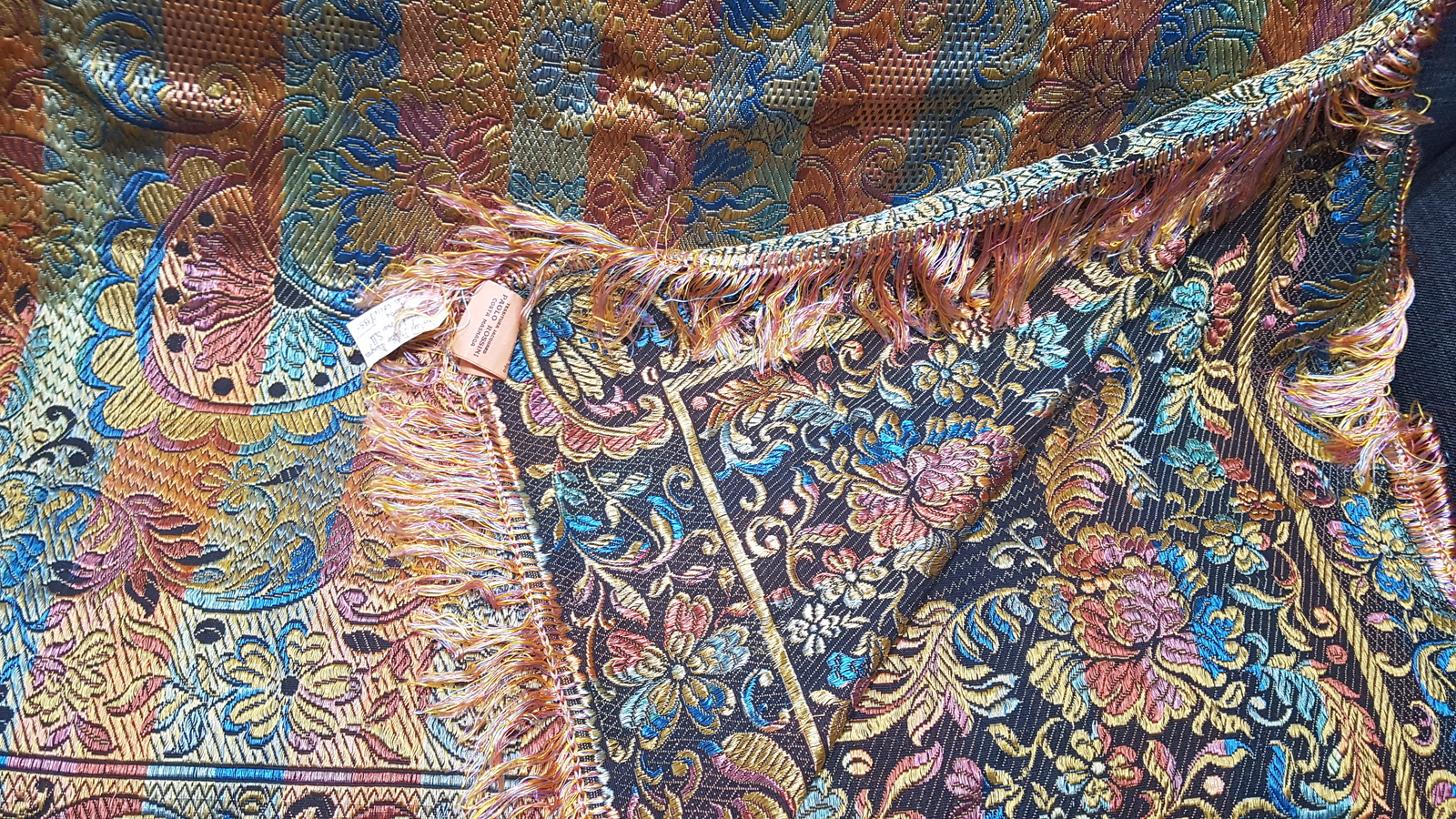 Discover our vintage Italian designer silk tapestry, handwoven and adorned with floral scrolls. Sourced from Paulo Rossini! Invest in this unique piece today.