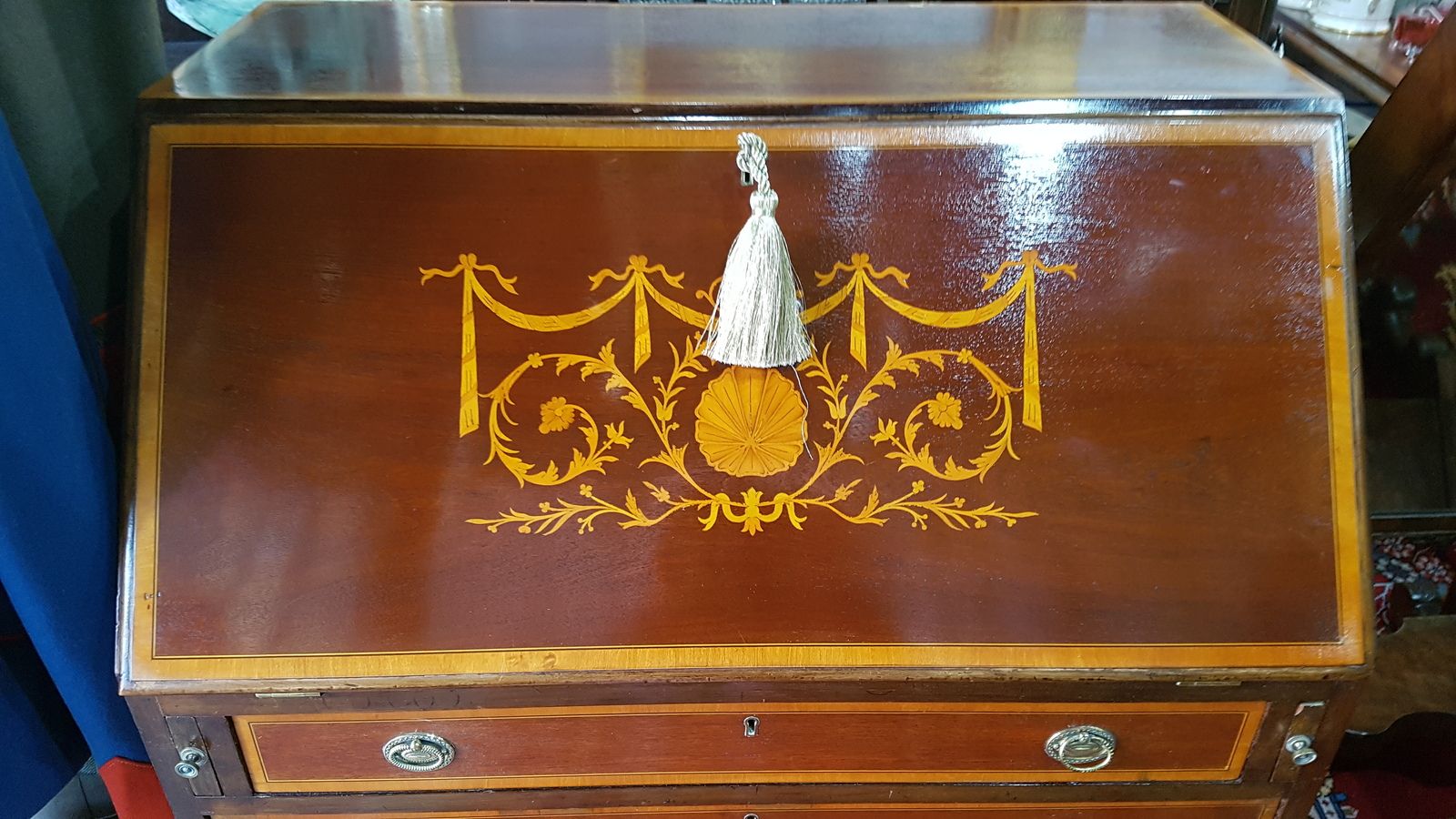 Discover our antique Edwardian mahogany bureau with intricate satinwood details. Shop now for this unique, well-preserved piece perfect for classic styled homes. Embrace history today!