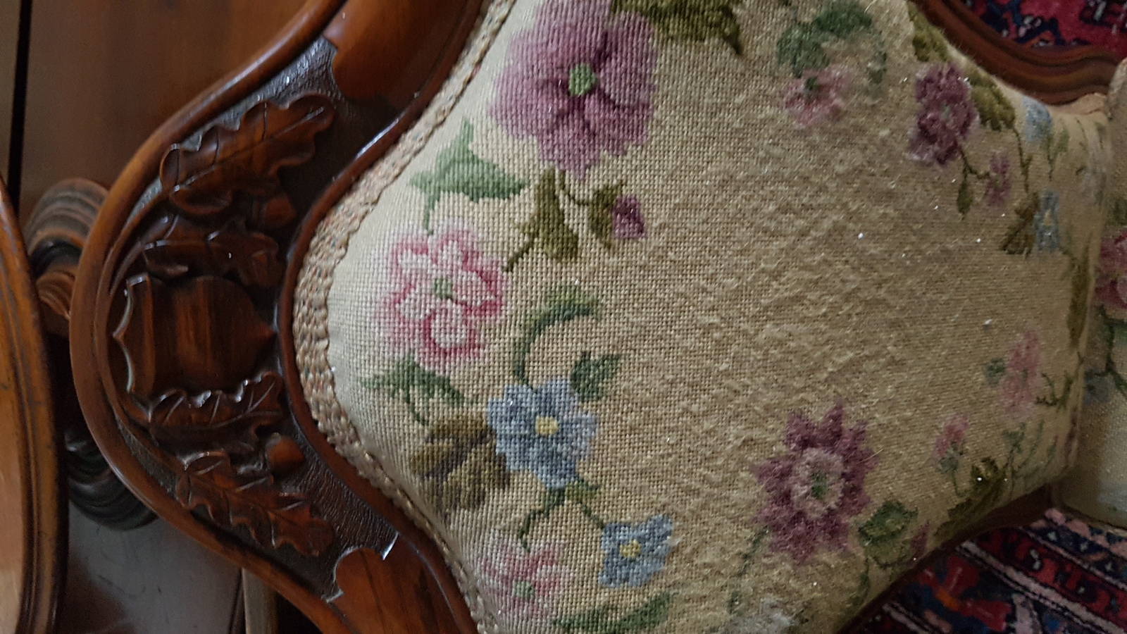 A Victorian Carved Walnut And Upholstered Nursing Chair