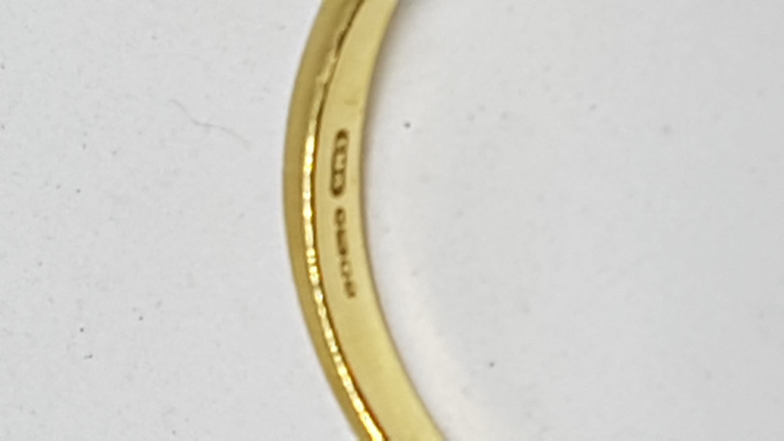 An 18 ct Yellow Gold Ring Set With Single Emerald Cut Ruby And Diamonds