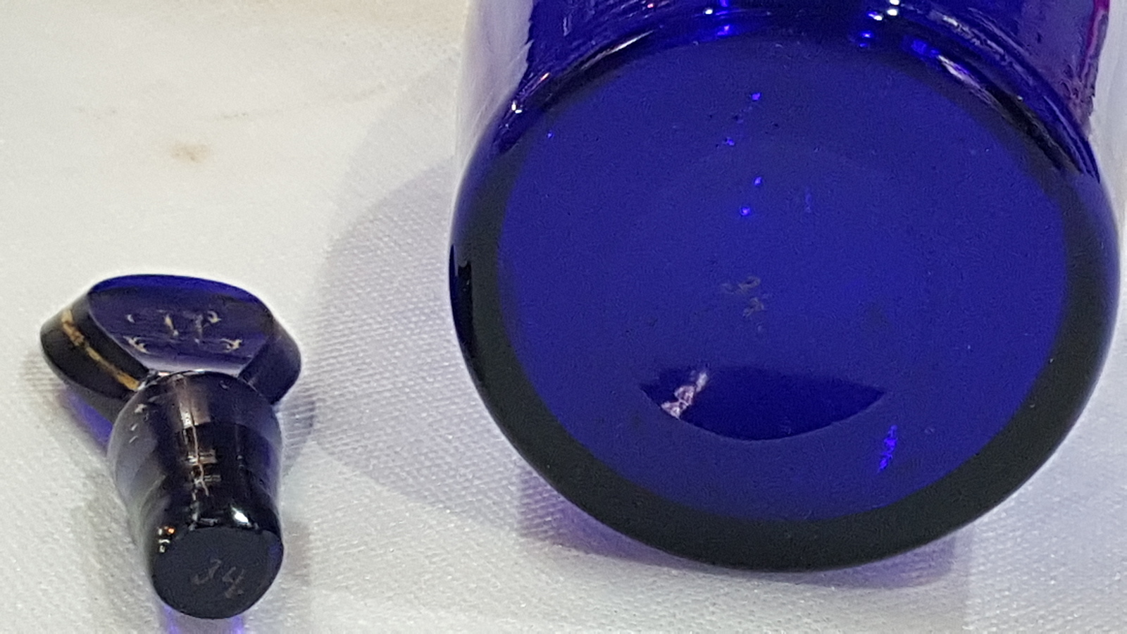 Discover our 19th c. Bristol blue decanter bottle with restored stopper. Unique gold lettering, size 9 inches. Shop now!