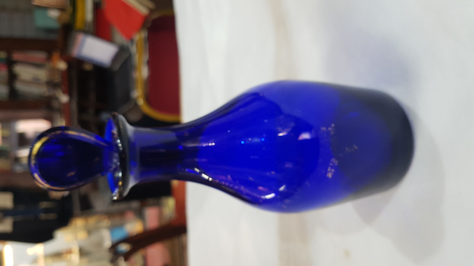 Discover our 19th c. Bristol blue decanter bottle with restored stopper. Unique gold lettering, size 9 inches. Shop now!