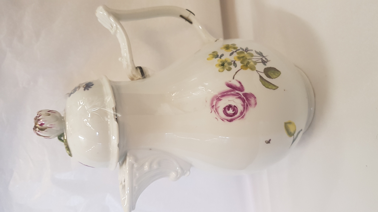 Discover the charm of 18th century Meissen porcelain coffee pot. Decorated with Deutsche Blumen on pure white ground, it's a perfect blend of art and history. Explore now!