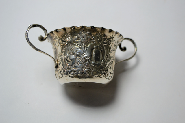 A Silver Two Handled Loving Cup With Repousse Decoration.